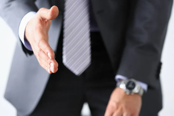 Mannen i kostym och slips ge hand som hello — Stockfoto