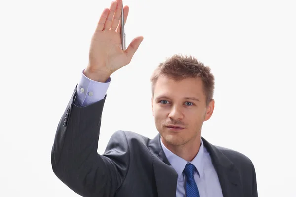 En affärsman håller en hand upp med en penna — Stockfoto