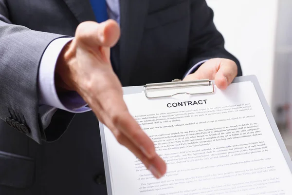 Man in suit and tie give hand as hello — Stock Photo, Image