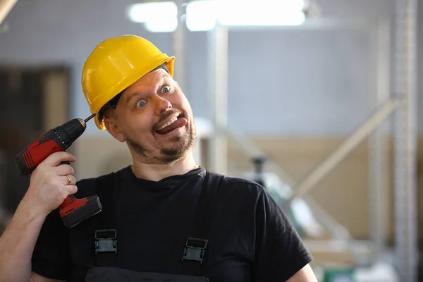 Idiot worker using electric drill portrait — Stock Photo, Image