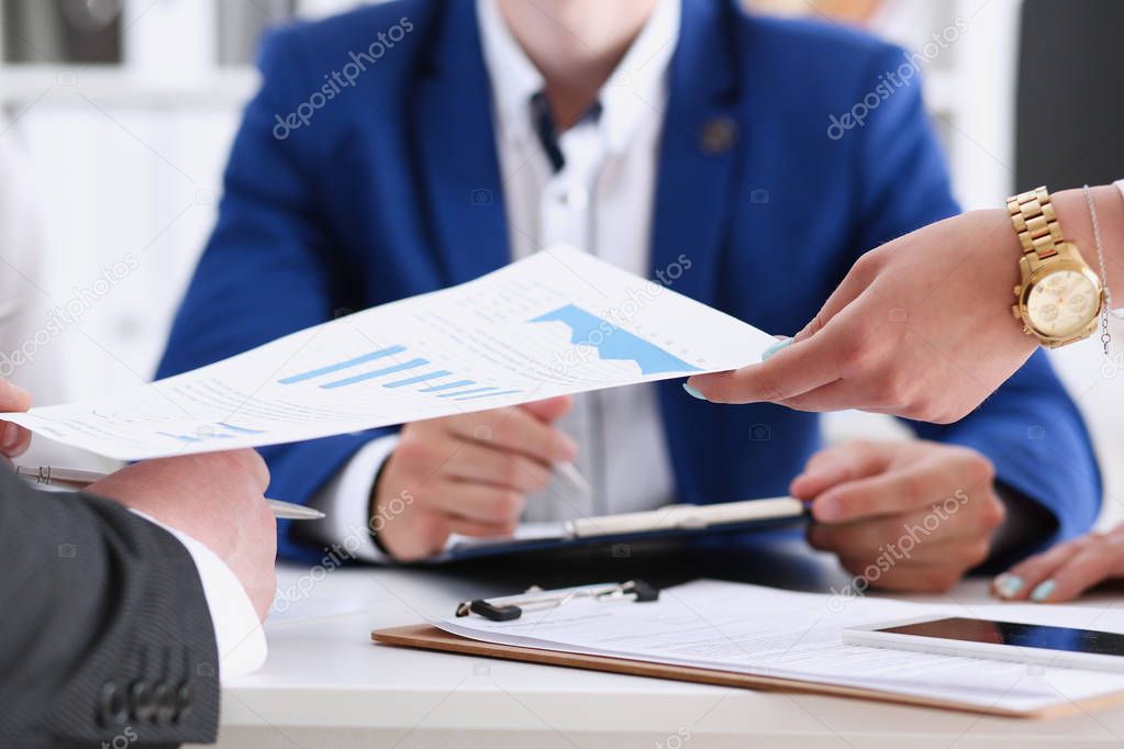 Group of people discuss financial results