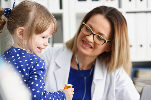Little child with stethoscope at doctor reception