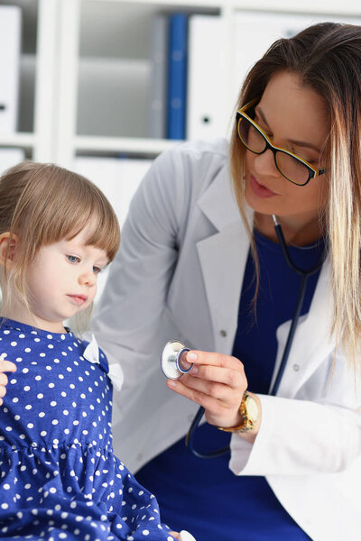 Little child with stethoscope at doctor reception