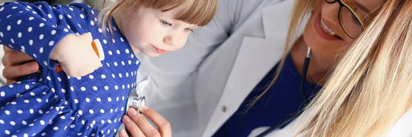 Little child with stethoscope at doctor reception — Stock Photo, Image