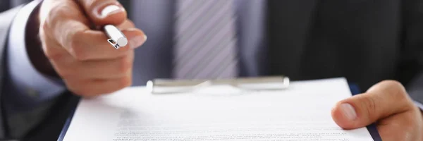 Male arm in suit offer contract form on — Stock Photo, Image