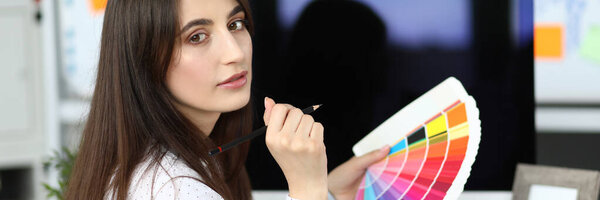 Cute lady holding colorful palette