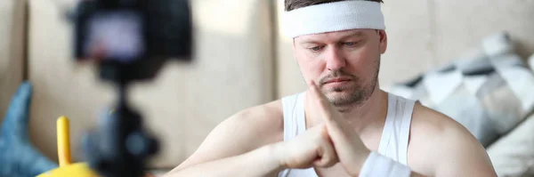 Serious Vlogger Doing Exercise for Hands on Camera — Stock Photo, Image