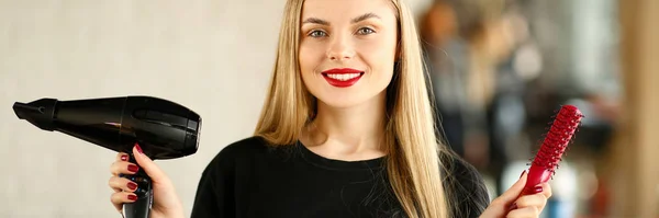 Young Hairstylist Holding Blow Dryer and Hairbrush — Stock Photo, Image