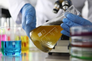 Person doing experiment with ampoule