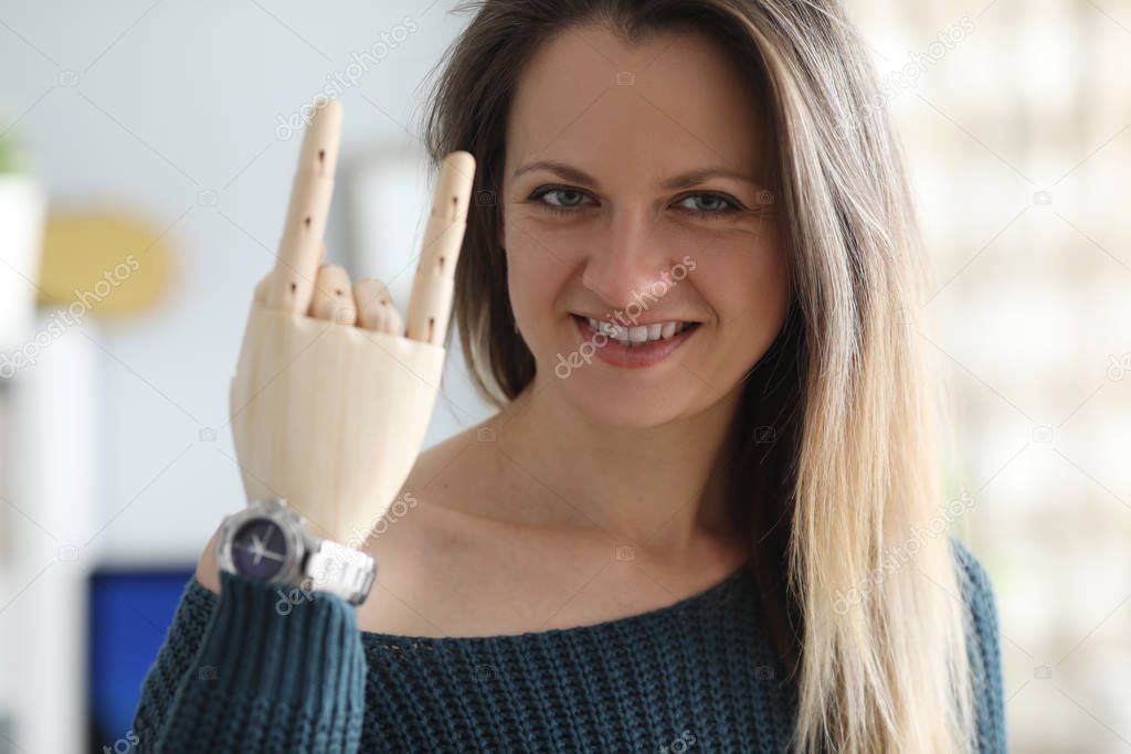 Smiling woman with prosthetic arm