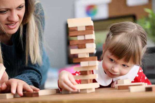 Happy girl playing with building kit — Stock Photo, Image