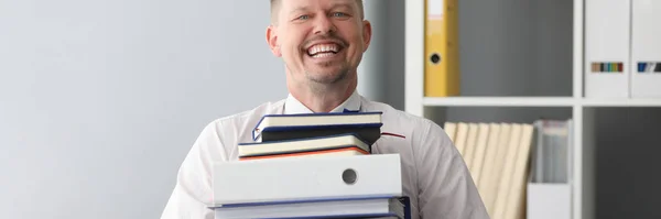 Happy office worker carry huge heavy pile of paper — Stock fotografie