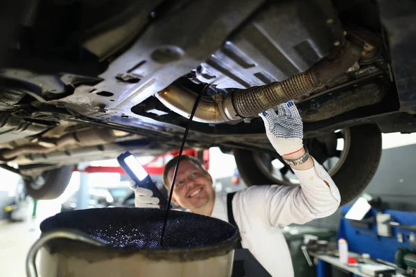 Mechanic conducts thorough inspection car garage. — Stok fotoğraf