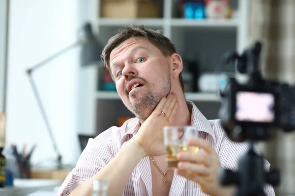 Man filming a video blog about an alcoholic drink — 스톡 사진