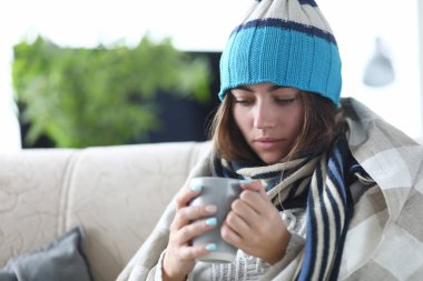 Sick person holding cup