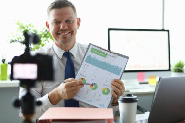 Smiling vlogger in office