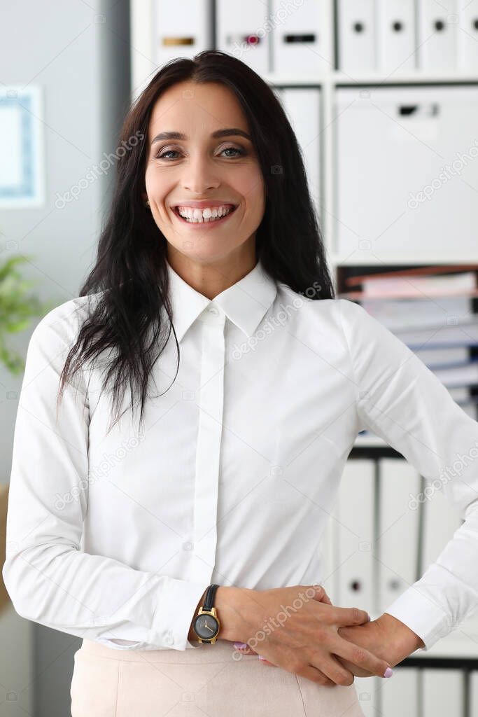 Girl in fashionable office clothes smiling widely