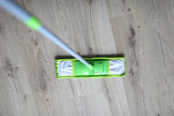 Close-up, mop standing laminate floor disinfection — Stock Photo, Image