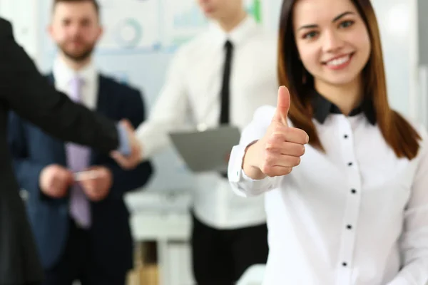 Woman showing confirm symbol during conference in office — Stock Photo, Image