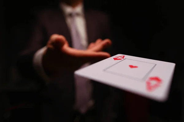 Player throwing playing card