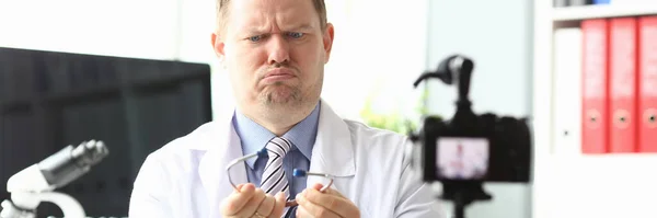 Doctor in front camera is surprised by stethoscope — Φωτογραφία Αρχείου