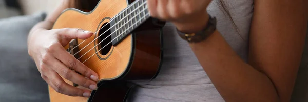 Small four-stringed guitar of hawaiian origin — Stock Photo, Image