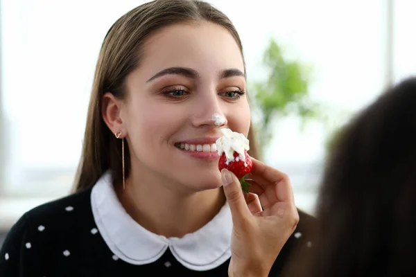 Girl stained her nose with cream from strawberries — Stock Photo, Image