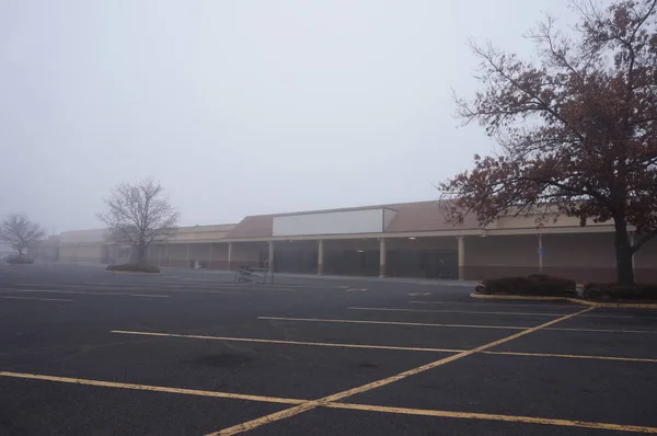 Abandoned Strip Mall Buildings in a Fog