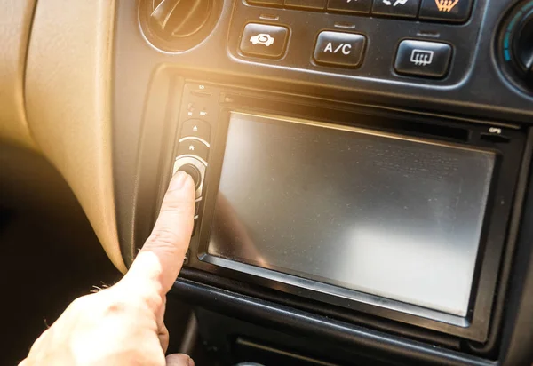 Press the power button on the car stereo. — Stock Photo, Image