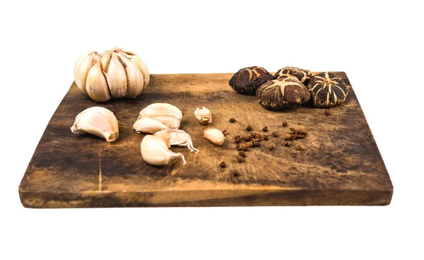 Vegetables, mushrooms and spices on a wooden cutting board. — Stock Photo, Image