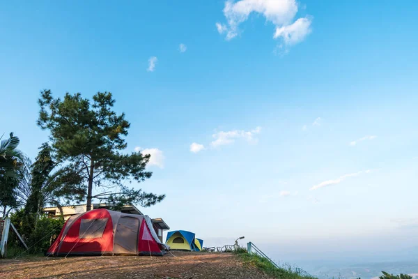 Tents sleep  above the hills, and the atmosphere in the morning.