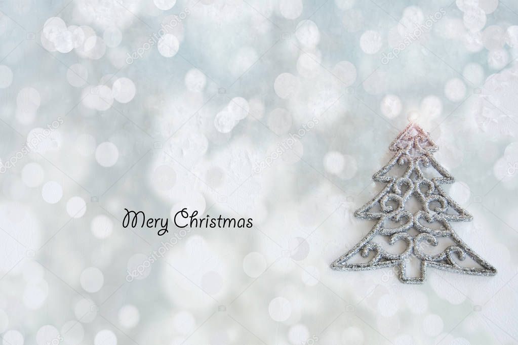 Christmas card silver Christmas tree on a bright shimmering pastel background.