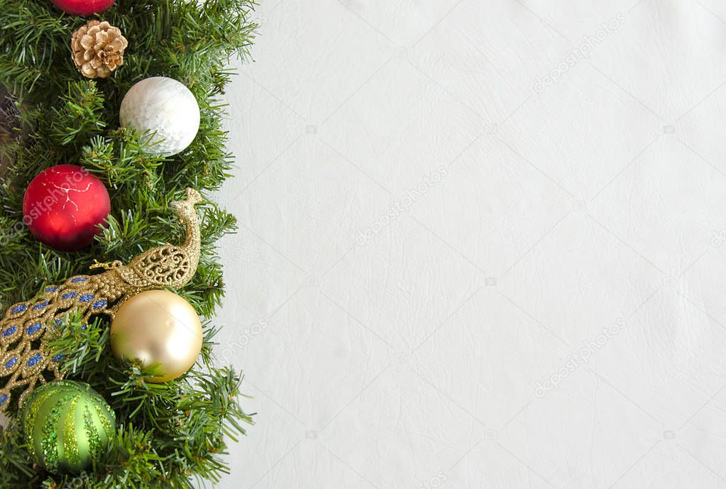 Christmas background, green garland, Christmas tree decorations on a white background.