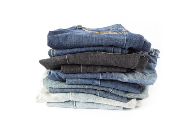 Blue jeans halmozott a elszigetelt fehér háttér Jogdíjmentes Stock Képek