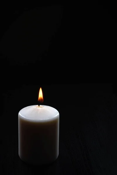 Burning Candle Black Background Stock Photo