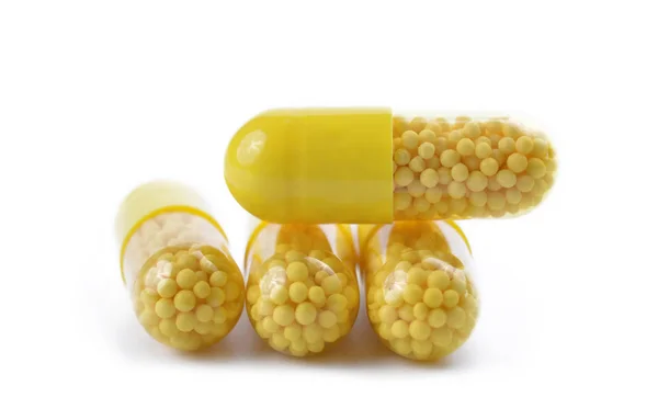 Yellow capsule pills — Stock Photo, Image