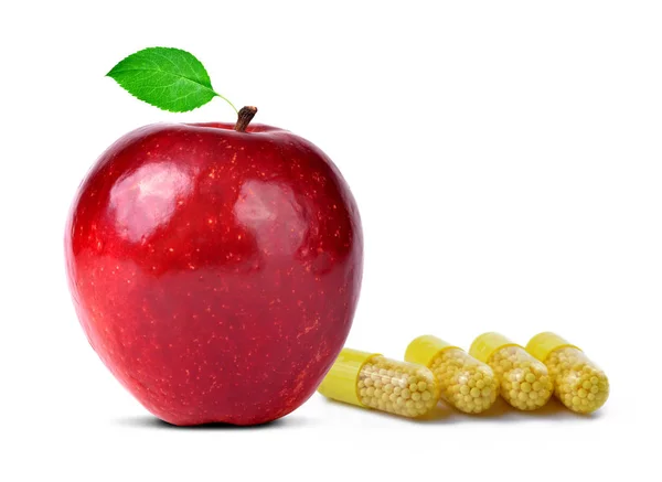 Red apple with vitamins capsule pills — Stock Photo, Image