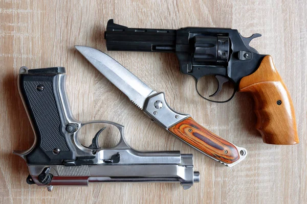 Metallic pistol with knife — Stock Photo, Image