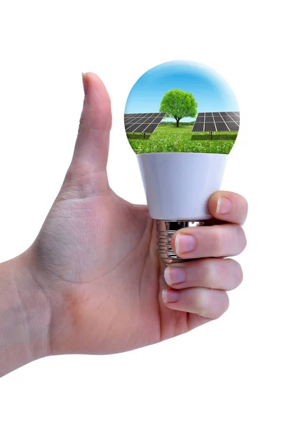 Hand with thumb up holding eco LED bulb with solar panel. — Stock Photo, Image