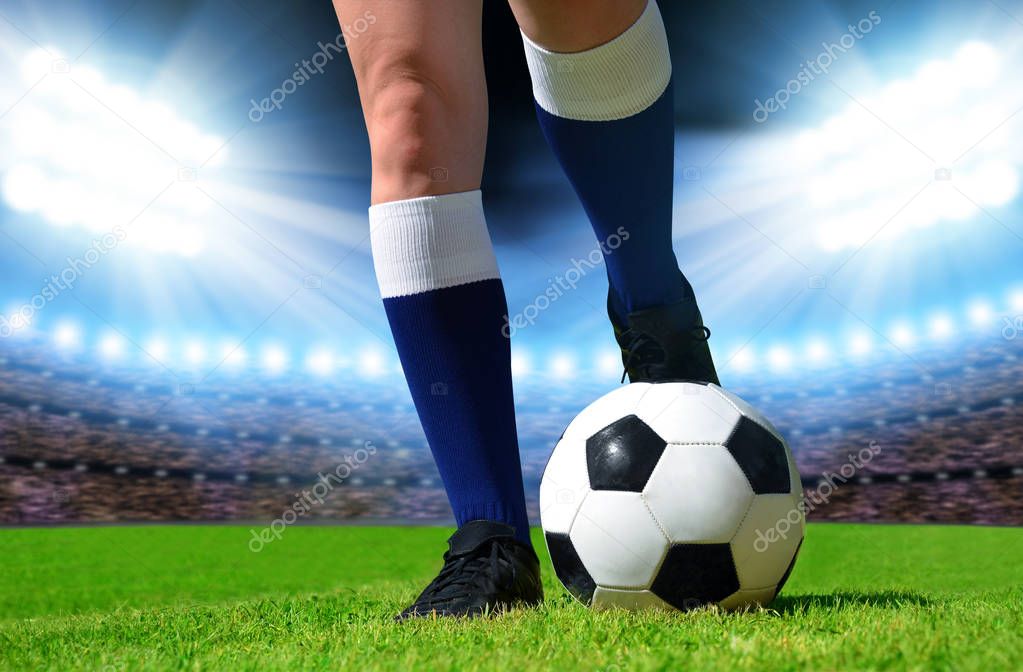 Soccer ball and foots of football player