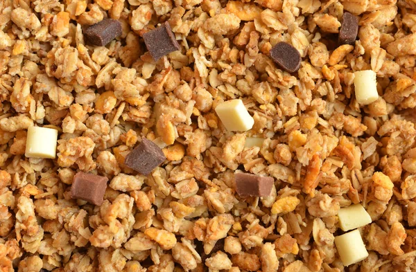 Muesli cereal with pieces of chocolate close up. — Stock Photo, Image