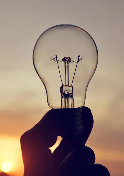 Electrical light bulb in hand. — Stock Photo, Image