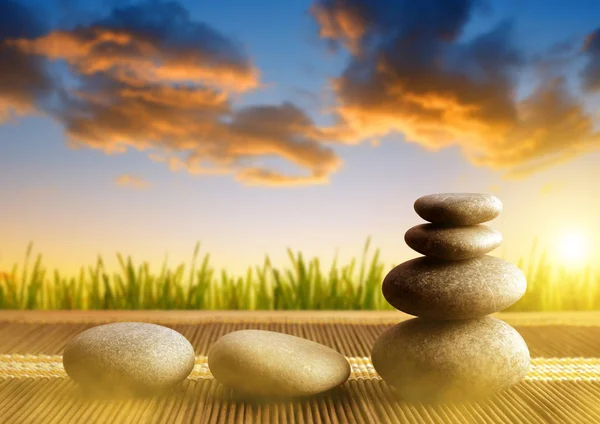 Stack of Zen pebble stones at sunset. — Stock Photo, Image