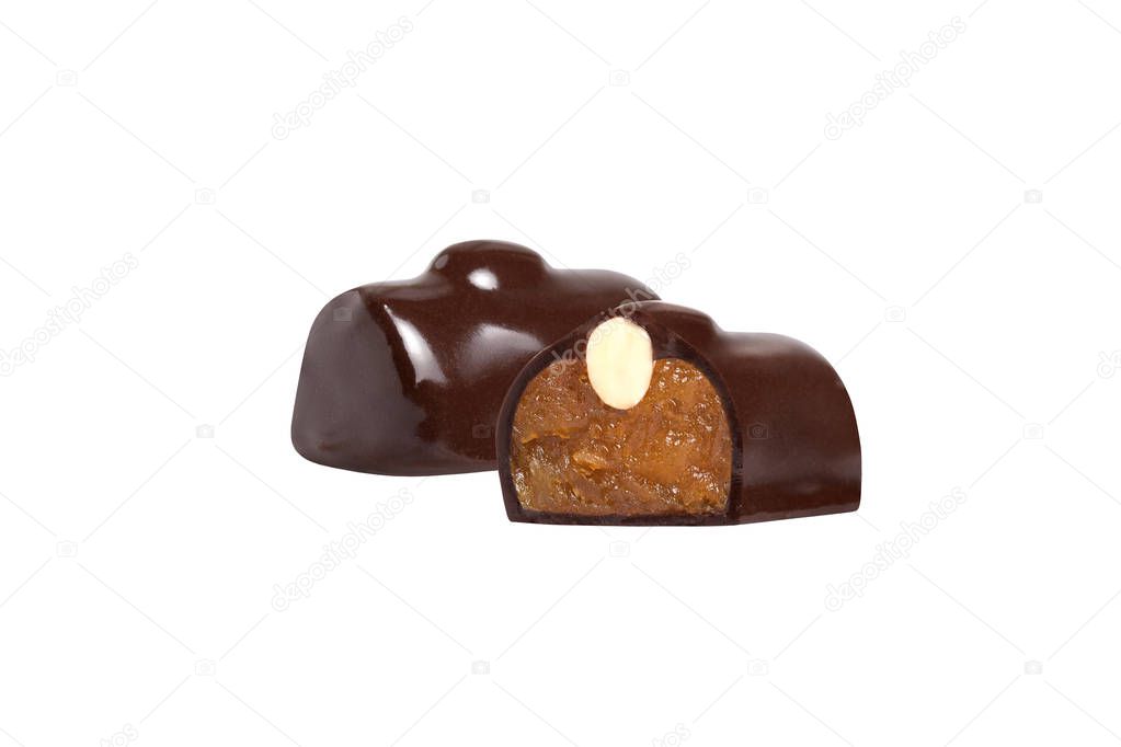 chocolate candy macro shot with nuts and delicious filling on white background, isolates