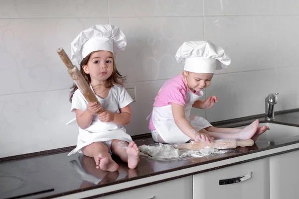 Happy family funny kids are preparing the dough, bake cookies in the kitchen — Stock Photo, Image