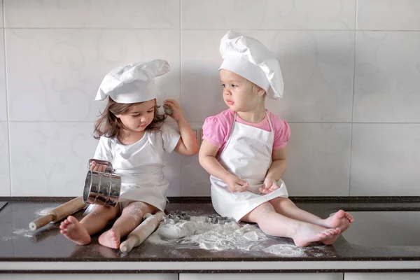 Happy family funny kids are preparing the dough, bake cookies in the kitchen — Stock Photo, Image