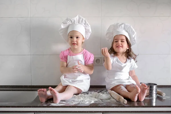 Happy family funny kids are preparing the dough, bake cookies in the kitchen — Stock Photo, Image