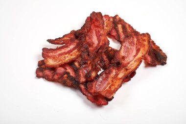 Three cooked, crispy fried bacon isolated on a white background. clipart