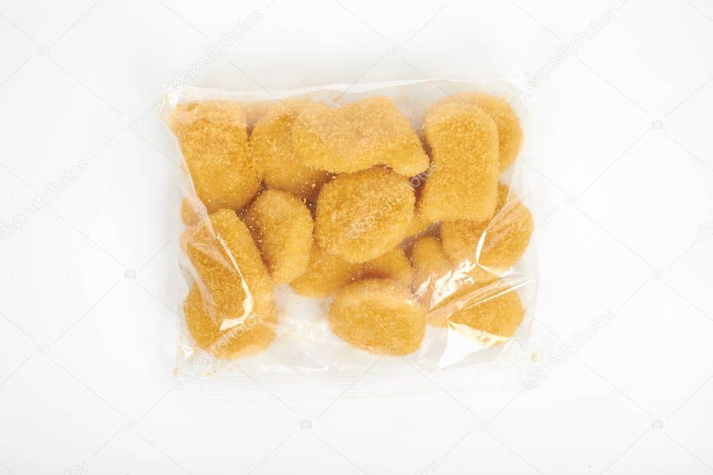 chicken nuggets in the package, isolated on white background