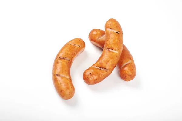 Grilled chicken sausages isolated on a white background — Stock Photo, Image